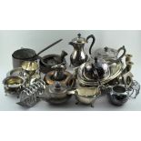 An assortment of silver plate and other metalware, including copper candlesticks, moulds,
