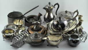 An assortment of silver plate and other metalware, including copper candlesticks, moulds,