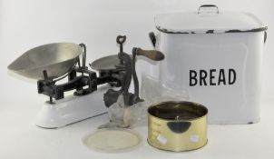 A vintage enamel bread bin together with a set of Avery scales, weights and a mincer,