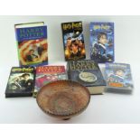 A collection of Harry Potter books, including First Editions,