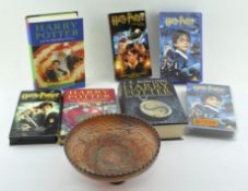 A collection of Harry Potter books, including First Editions,