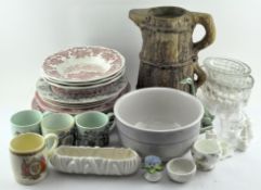 An extensive assortment of ceramics, including Wedgwood plates, glass jelly moulds,