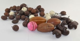 A collection of cork screws in the form of vintage leather footballs,