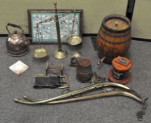 An assortment of brassware and vintage barrels,