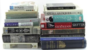 A collection of books on Antiques Price Guides,