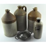 Four brown stoneware flagons, a pewter dish and cover and a fleur-de-lys dish or mould,
