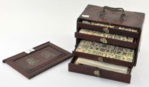 A Chinese mahjong set, in original five draw case, the pieces bone on bamboo,