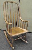 A 20th century vintage rocking chair in the manner of Lena Larsson,