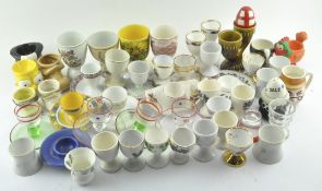 A collection of assorted ceramic egg cups of various shapes and designs