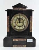 A Victorian slate mantel clock with marble inlay and partially exposed mechanism to dial,