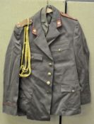 Two boxes of assorted Russian Military uniforms and related clothing
