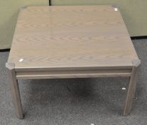 A vintage coffee table of square form,