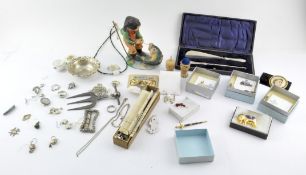 A box of assorted items, including: a silver toasting fork,