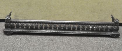 A metal fire surround with pierced decoration,