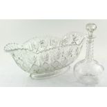 A glass decanter together with a large glass centrepiece dish,