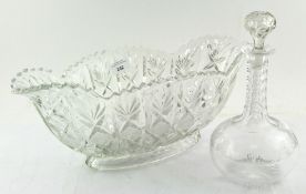 A glass decanter together with a large glass centrepiece dish,