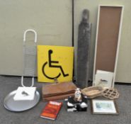 A collection of items to include a disabled sign and other items