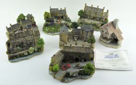 A collection of model houses and cottages, including David Winter Cottages,