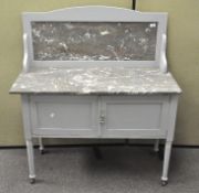 A grey painted wooden wash stand with marble top.