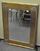 A giltwood and gesso rectangular wall mirror with bevelled edge,