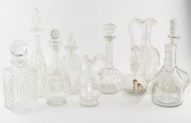 A collection of cut and etched glass decanters, spirit bottles and claret jugs, 19th/20th century,