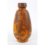 A large 1960's vintage West German Pottery floor vase, having a footed base and bulbous form,