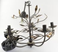 A modern metal five-light chandelier, with leafy branches and fittings,