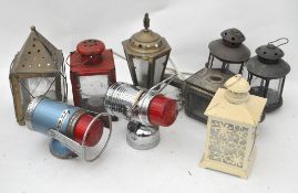 A collection of nine assorted lanterns to include a Pifco and a Vidor example
