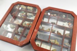 Two glass fronted collector's cabinets containing a variety of small ceramics,