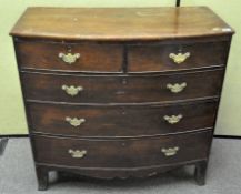 A late 19th century bow fronted mahogany chest of drawers,