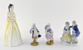 Four ceramic figures, including a lady in Welsh dress,