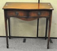 A mahogany side table with two single drawers to front, on tapering legs,