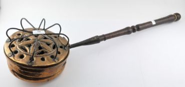 A Victorian pierced copper chestnut roaster with turned wooden handle,