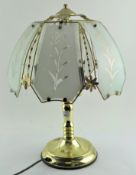 A modern gilt metal three light table lamp with opaque floral shade, 52 cm,
