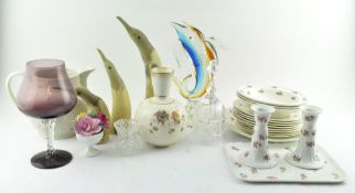 A mix of assorted items, including carved horns in the form of ducks,