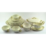 A Frank Buckley production dinner service, with gilt rims and handles, to include: a tureen,