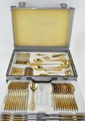 An extensive 23/24 karat gold plated canteen of cutlery by SBS Bestecke Solingen,