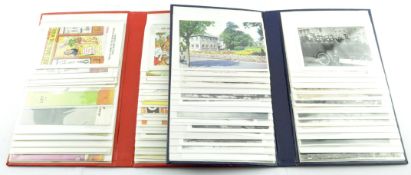 Two postcard albums containing assorted postcards,