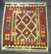 A small vintage floor rug with abstract style design,
