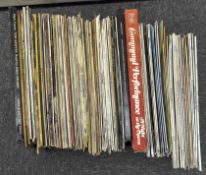 A collection of vinyl records, including pop (Sgt Pepper's Lonely Hearts Band), classical,