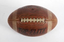 A Spalding Top-Flite J5V signed American football, 1974, in brown leather, signed Pollard,