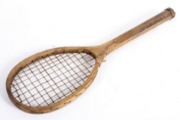 A child's vintage wooden tennis racquet,