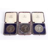 A 1920's 'Health, Strength and Loyalty' silver medal, dated 1927; together with two bronze examples,