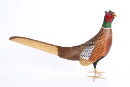 A wooden model of a pheasant, enriched in naturalistic colours, 20th century,