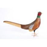 A wooden model of a pheasant, enriched in naturalistic colours, 20th century,