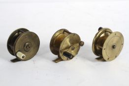 A group of three vintage brass fishing reels, one stamped DAM/Effzett 495