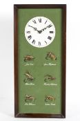 A novelty fishing fly clock, with six flies beneath the dial, battery operated, 56cm high,