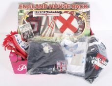 A box of England memorabilia, including flags, scarves, programmes,