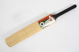 A Surrey County Cricket Club signed cricket bat