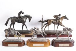 Five equestrian sculptures or trophies, comprising: three silver trophies for races in 2008...